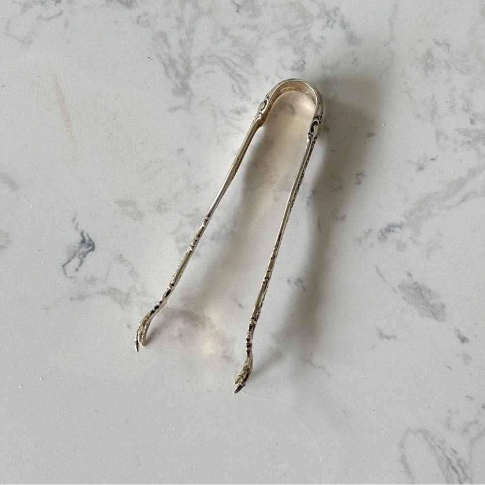 Antique sterling sugar tongs made by Whiting Manufacturing Co